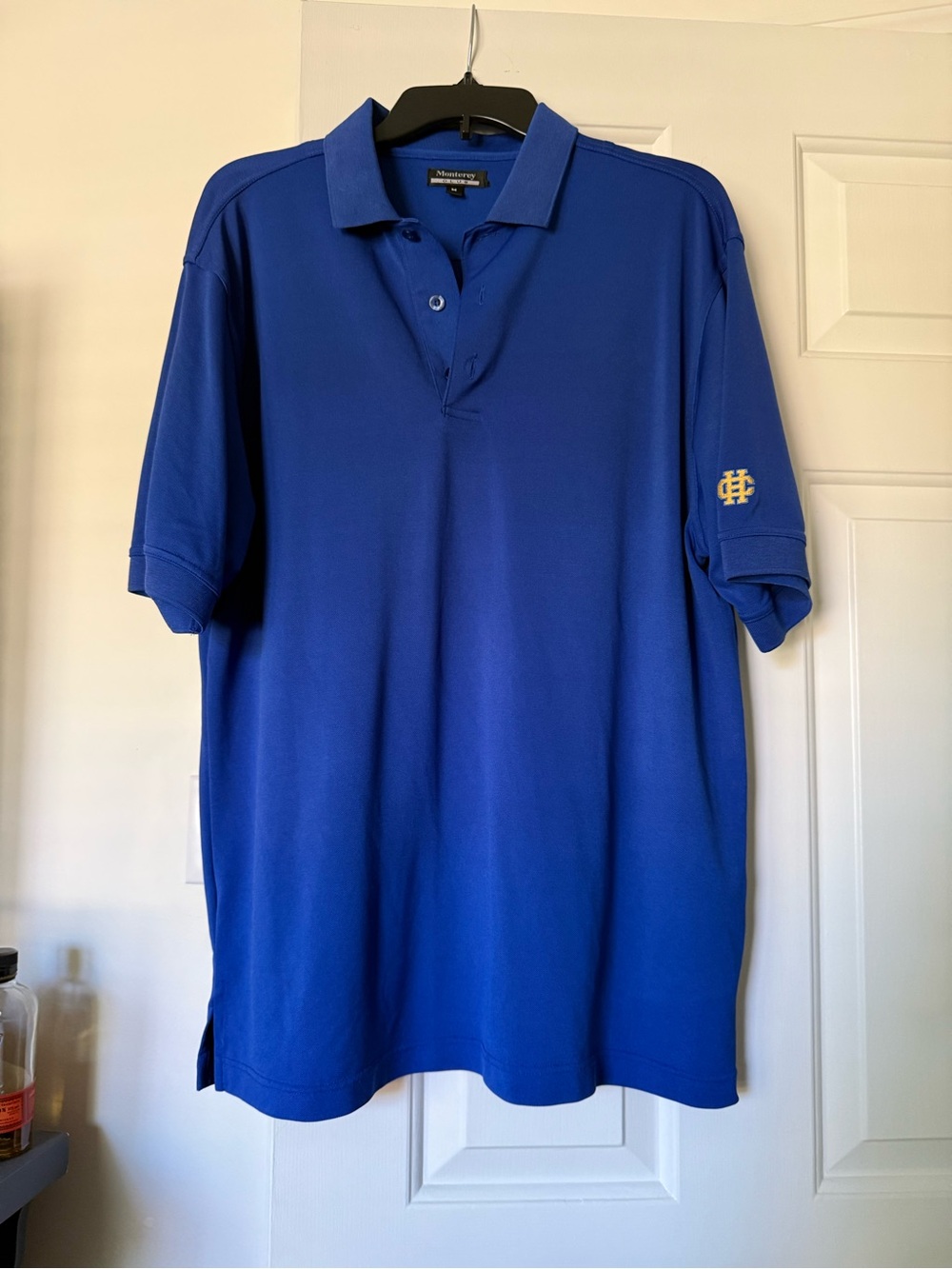 Monterey Bay Men’s Royal Blue Polo with Sleeve Emblem